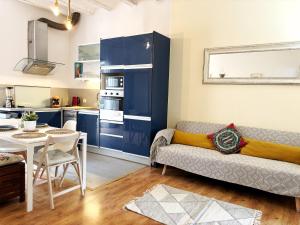 a living room with a couch and a table at MODERN FLAT POBLE NOU in Barcelona