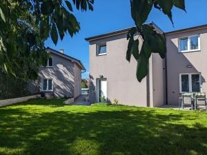 a house with a lawn in front of it at Apartmány U Lazara in Kutná Hora