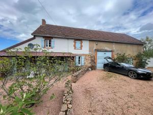 a black car parked in front of a house at Villa Souvenir, Lenax in Lenax