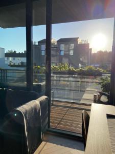 a balcony with a view of a building at Nice and modern apartment in Stavanger