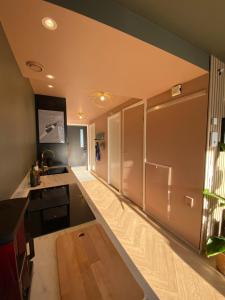 a kitchen with a refrigerator and a counter top at Nice and modern apartment in Stavanger +7 photos
