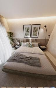 Giường trong phòng chung tại Villa Golfinho Luxury