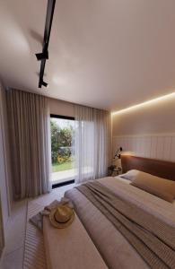 Giường trong phòng chung tại Villa Golfinho Luxury