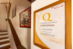 a picture of a sign on a wall at Locanda Del Mulino in Maranello