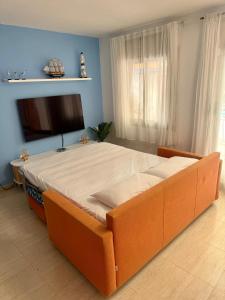 Ένα ή περισσότερα κρεβάτια σε δωμάτιο στο Petit Paradís