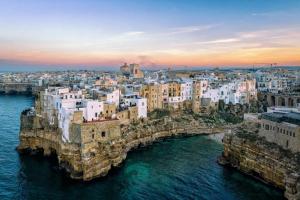 an aerial view of a city with a bridge over the water at Soffio Marino in Polignano a Mare