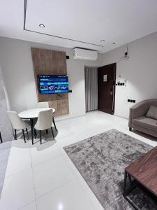 TV a/nebo společenská místnost v ubytování افاق الصفوة للشقق المخدومه afaq alsafwa serviced apartments