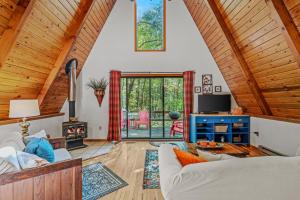 a living room with a couch and a fireplace at Cozy - Experience It All in Berkeley Springs