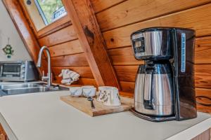 a kitchen with a coffee maker on a counter at Cozy - Experience It All in Berkeley Springs