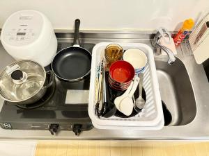 筑紫野市にあるHotel kuroの台所の流しに置かれた調理器具のトレイ +11枚の写真