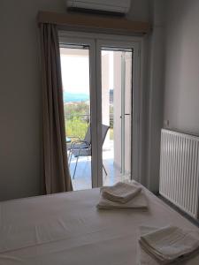 Ένα ή περισσότερα κρεβάτια σε δωμάτιο στο VDA Kalamata +45 φωτογραφίες