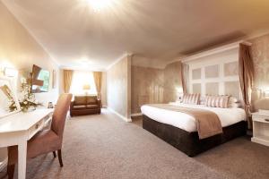 a bedroom with a bed and a desk in a room at The Old Golf House Sure Hotel Collection by Best Western in Huddersfield