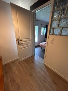 an open door to a room with a bedroom at Chambre indépendante au pied de la Rhune in Urrugne