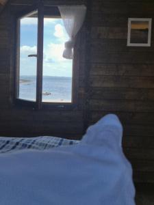 Katil atau katil-katil dalam bilik di Cois Farraige Glamping Pod