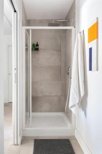 a bathroom with a shower with a glass door at Casa Madonia in Terrasini