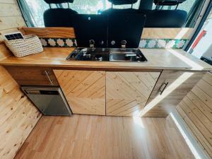 a kitchen with a sink in a tiny house at Van Ducato in Puerto del Rosario