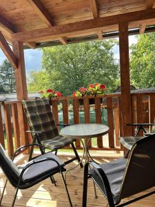 a patio with chairs and a table on a deck at Rodinný dom u Veroniky in Snina