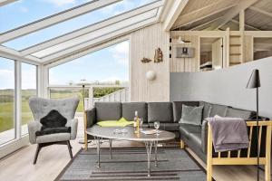 a living room with a couch and a table at G608-Lemvig-Gyvelvej-8 in Lemvig