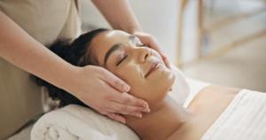 a woman getting a massage at a spa at City World Apartment in Maia
