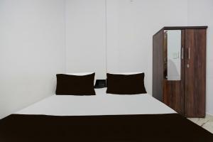 Ένα ή περισσότερα κρεβάτια σε δωμάτιο στο Hotel O Shri Panchmukhi Residency Baran Road