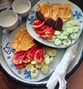 two plates of food on top of a table at Oazaa Retreat in Gusinje