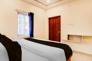 Ένα ή περισσότερα κρεβάτια σε δωμάτιο στο Hotel O Rainbow