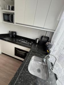 Kuchyň nebo kuchyňský kout v ubytování Hospedagem da Marli Bombinhas