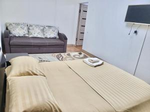 Postel nebo postele na pokoji v ubytování Владимирская 2а