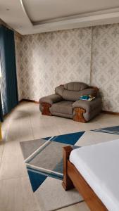 a living room with a couch and a bed at 2bedrooms in Nyali close to the beach in Mombasa in Mombasa