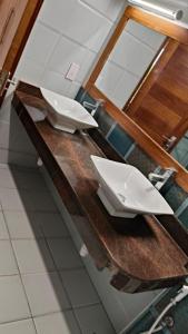 two white sinks on a counter in a bathroom at 2bedrooms in Nyali close to the beach in Mombasa in Mombasa
