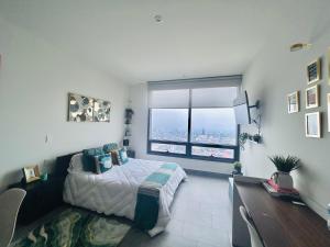 Postel nebo postele na pokoji v ubytování Loft Reforma Embassy USA