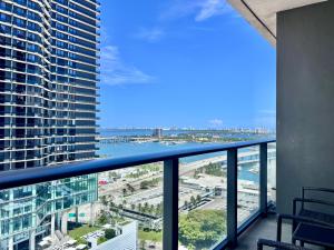 a view of the ocean from the balcony of a building at SPECIAL OFFER - Luxury High Rise Downtown Miami - Bay Views and Top Amenities in Miami
