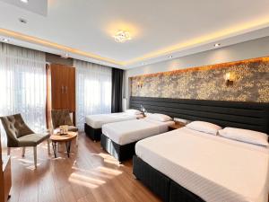 Ένα ή περισσότερα κρεβάτια σε δωμάτιο στο Mamma Marya Hotel