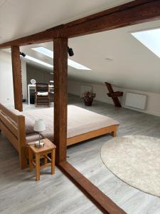 a large room with two beds and a table at Dream Apartment in Liepāja