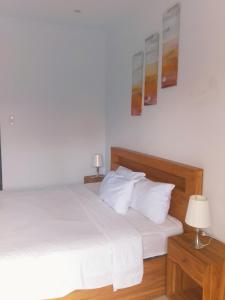 Postel nebo postele na pokoji v ubytování wirati Jeneng Guest house