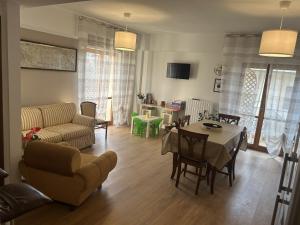 a living room with a couch and a table at La Sosta del Viaggiatore in Sulmona