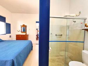 a bedroom with a bed and a glass shower at Morada da Praia - Porto de Pedras à Beira-Mar in Pôrto de Pedras +139 photos