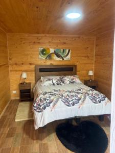 Ένα ή περισσότερα κρεβάτια σε δωμάτιο στο Condominio Bucalemu