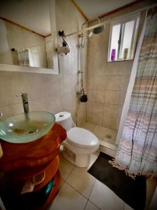 a bathroom with a sink and a toilet at Cabin in Puerto Godoy - Maullin in Maullín +6 photos