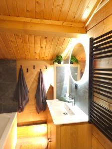 a bathroom with a sink and a bath tub at Chalet du Bief , Morillon 4-6 pers in Morillon +26 photos