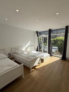 Katil atau katil-katil dalam bilik di CityStay Bergisch Gladbach Apartments & Rooms +139 gambar