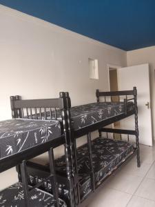 Voodi või voodid majutusasutuse Sheymar Hostel Pindamonhangaba toas