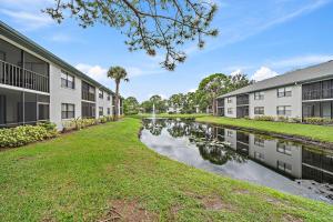 a canal in the courtyard of a apartment building at Stylish and Modern Shorewalk condo close to top beaches, heated pools, hot tub, IMG Academy, dining in Bradenton