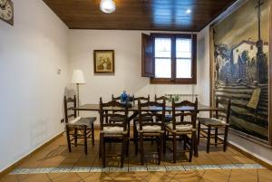 a dining room with a table and chairs at Casa LART RUPIT in Rupit