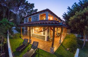 a house with a gazebo in the yard at Lakefront Villa with Beach Access & Infinity Pool in San Pedro La Laguna +36 photos