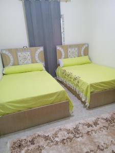 Ένα ή περισσότερα κρεβάτια σε δωμάτιο στο Near Pyramids Apartment