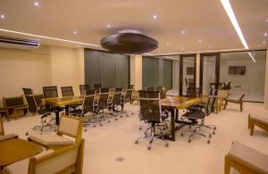 a conference room with tables and chairs in an office at Tulum Getaway with Jacuzzi & Pools in Tulum +34 photos