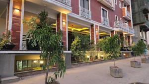 a building with potted plants in front of it at Studio for rent Addis Ababa, KMAN in Addis Ababa