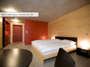 全能酒店 - 旅馆住宿/瑞士小屋客房内的一张或多张床位