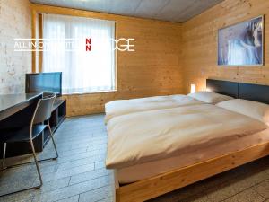 全能酒店 - 旅馆住宿/瑞士小屋客房内的一张或多张床位